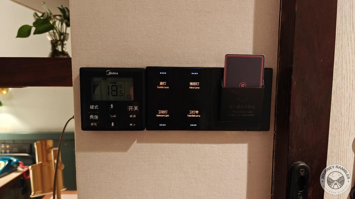 console for controlling the lights and air conditioning for the room