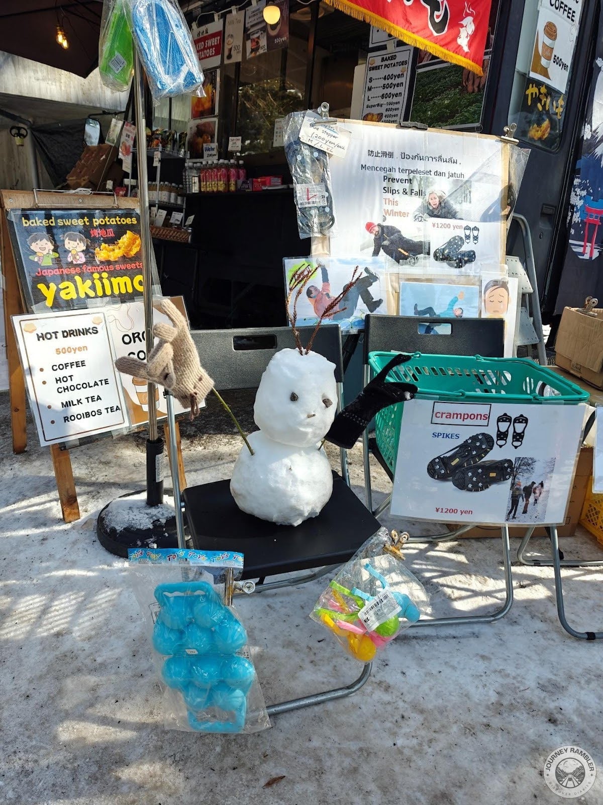 store selling hot drinks, baked sweet potatoes, and crampons