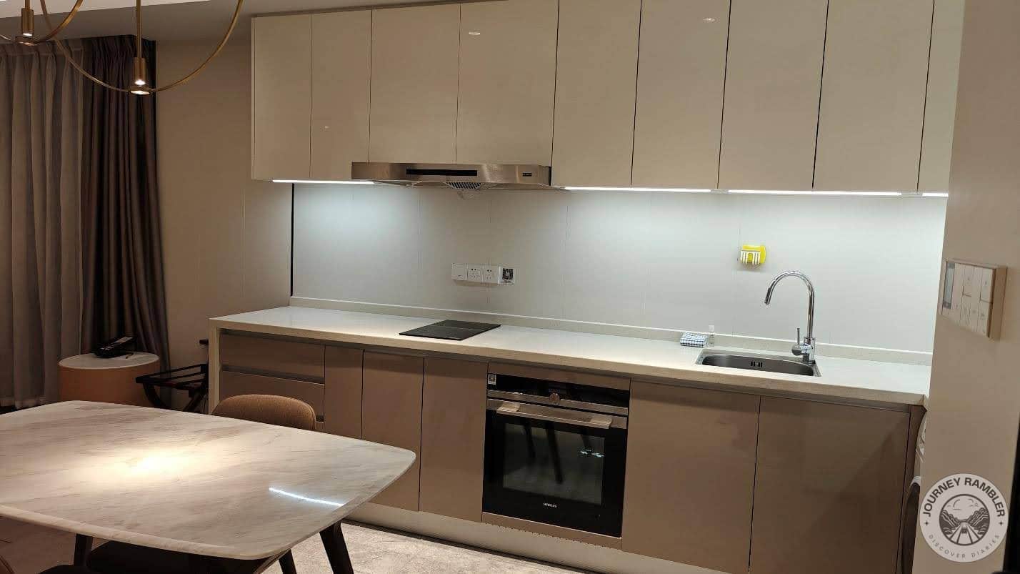 kitchen that featured an oven as well as an induction cooker