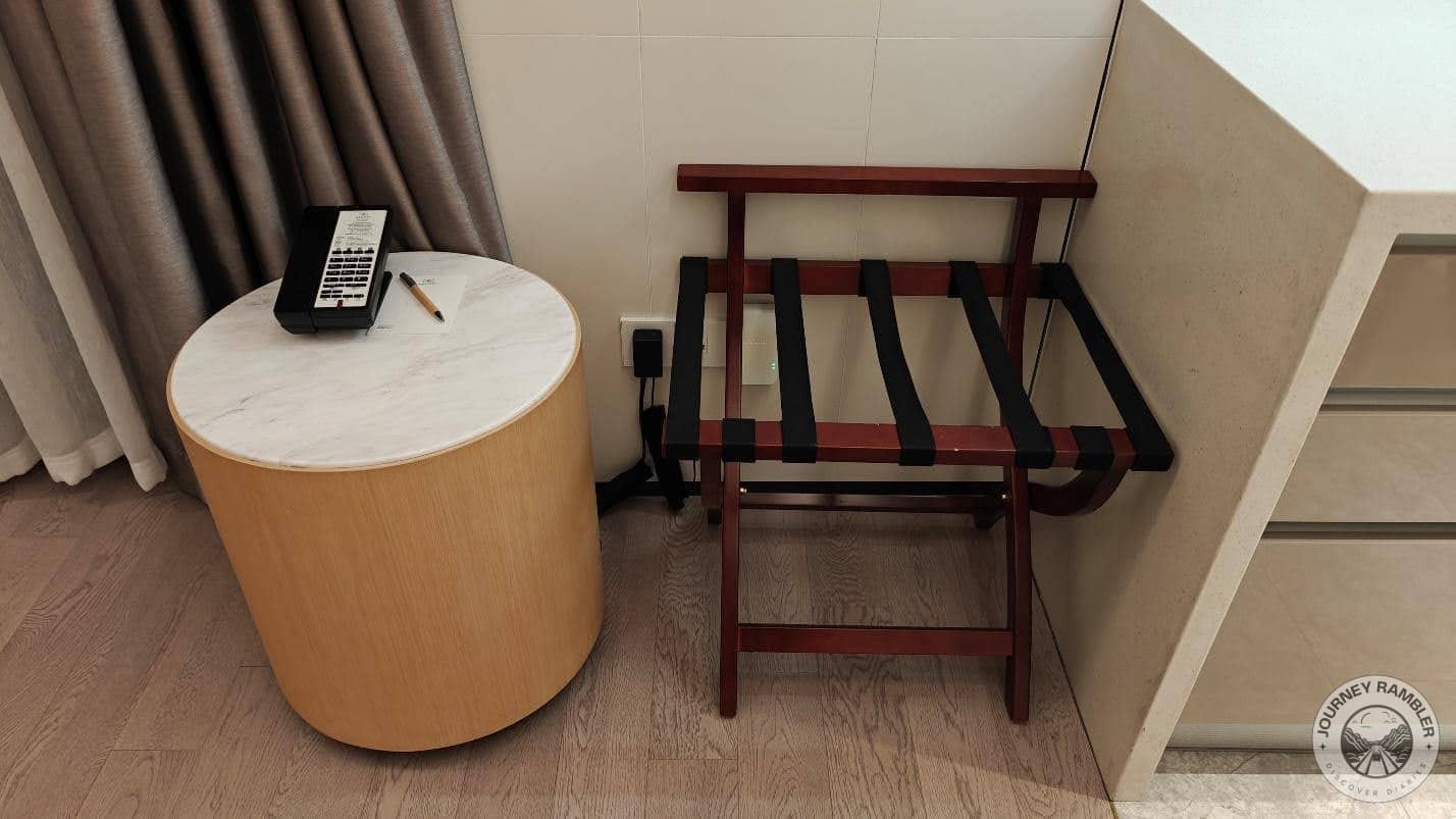 luggage rack and small cocktail table