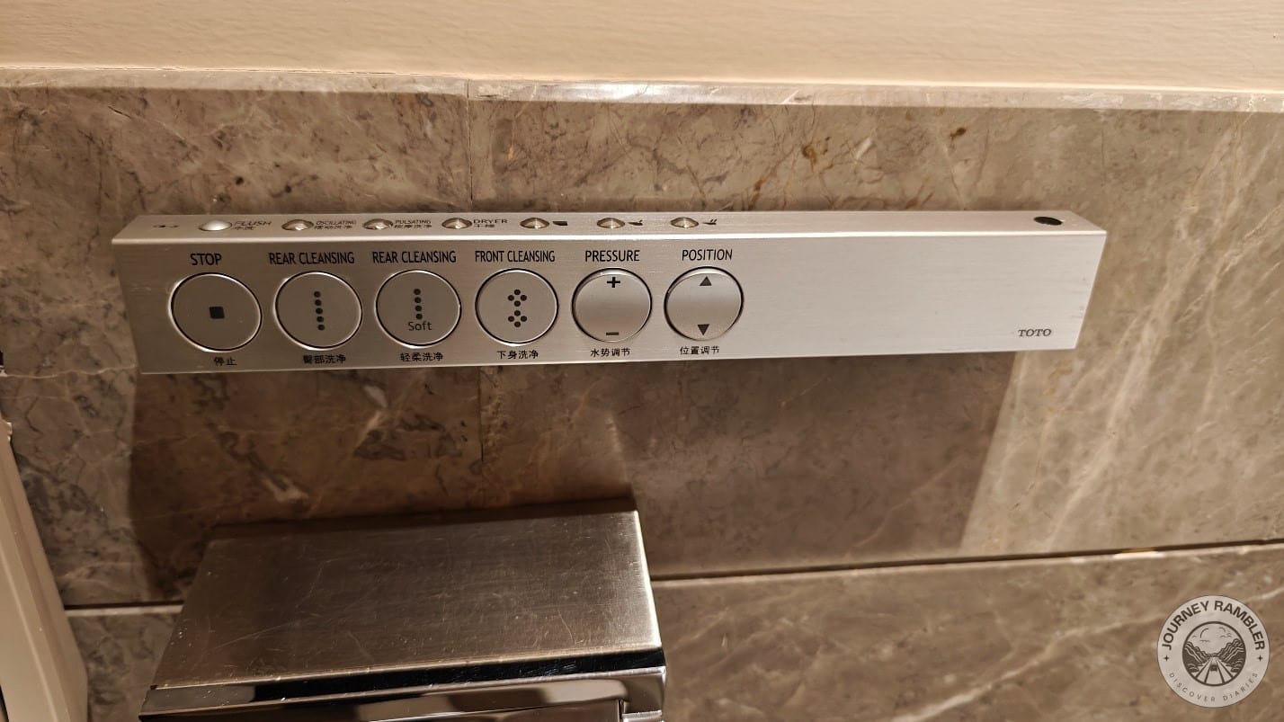 bar which controls the bidet feature of the toilet