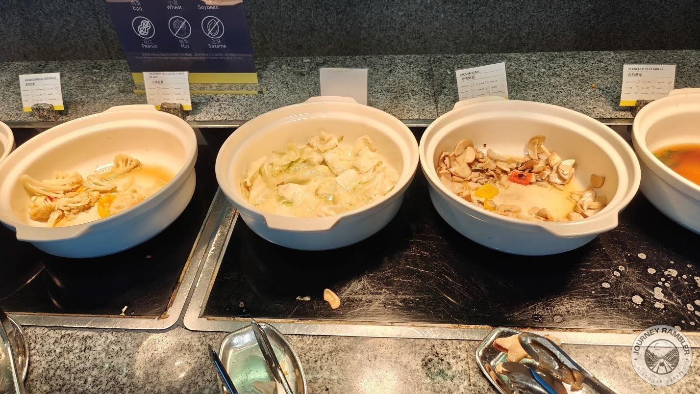 bowls containing sauteed cauliflower, cabbages, and mushrooms
