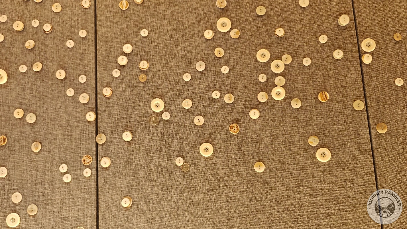 buttons stuck on the wall