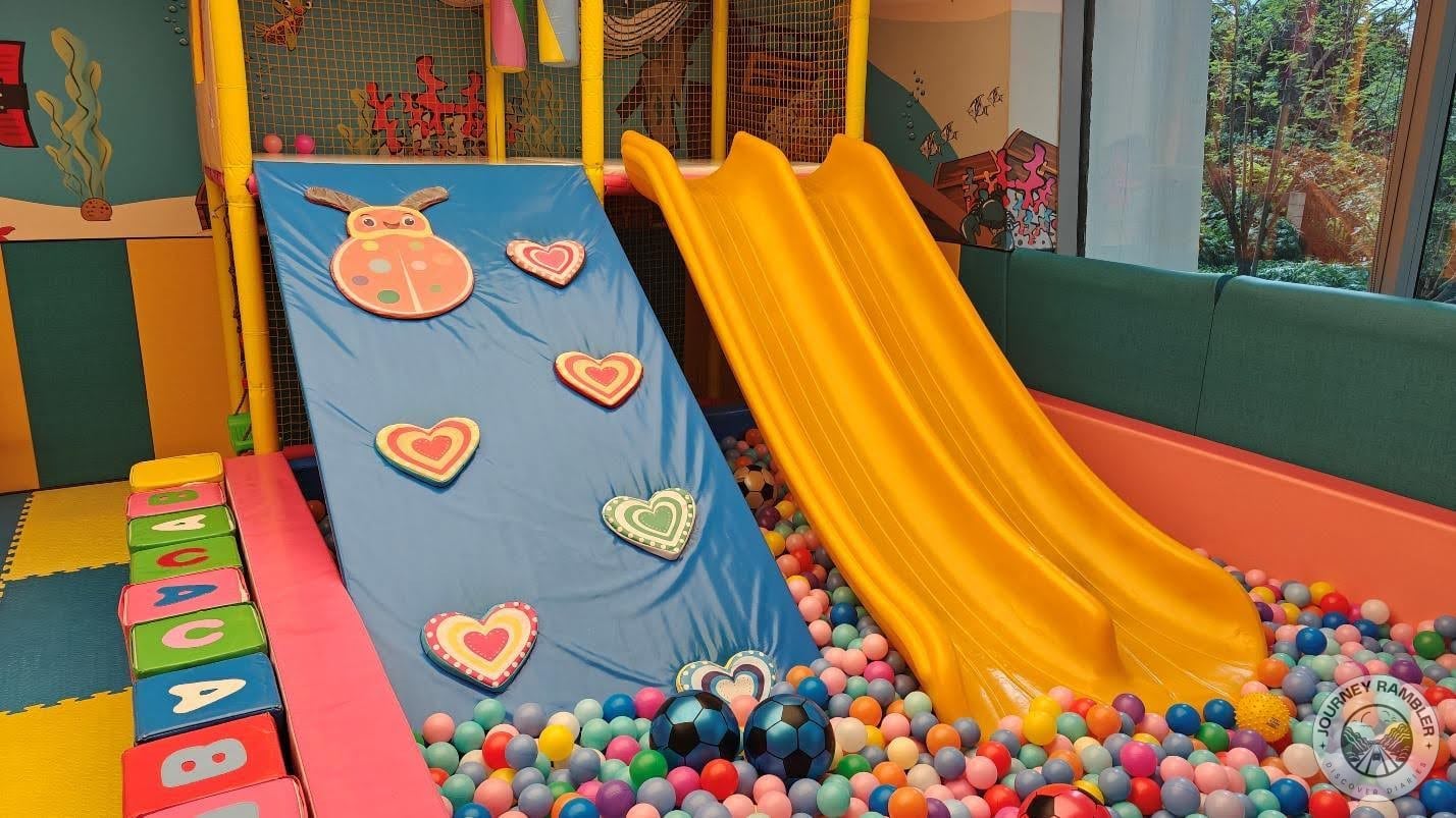 closer look at the climbing wall and the slide