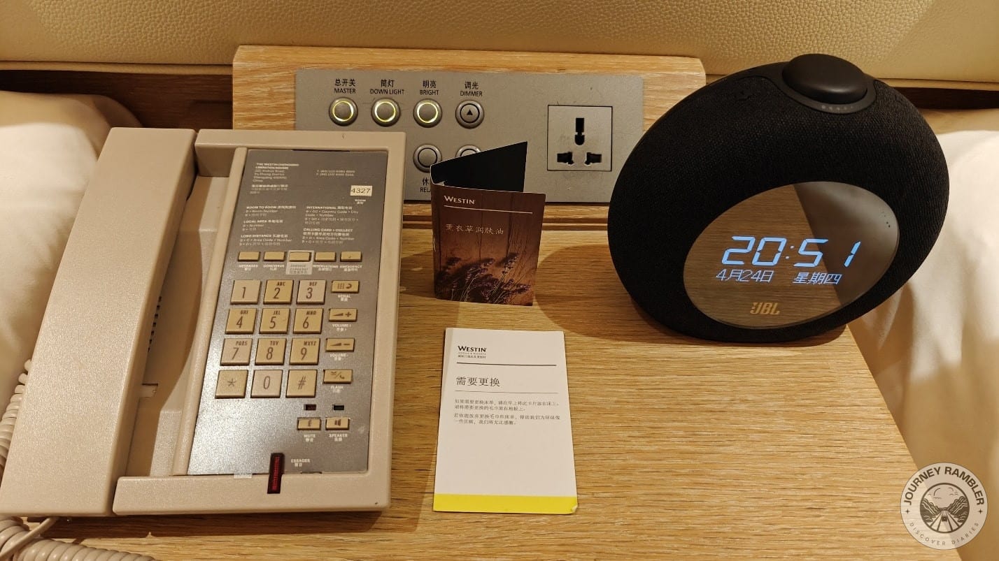 digital clock, a telephone, and the controls to the lighting