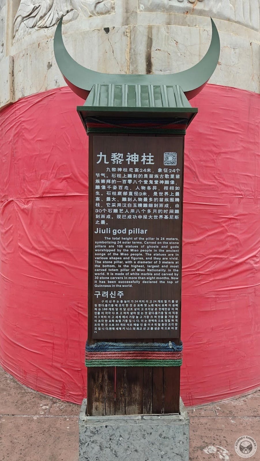 plaque with a description that is in three languages