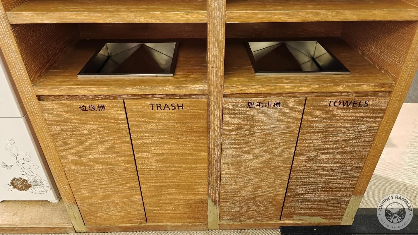 separate bins for the trash and the towels
