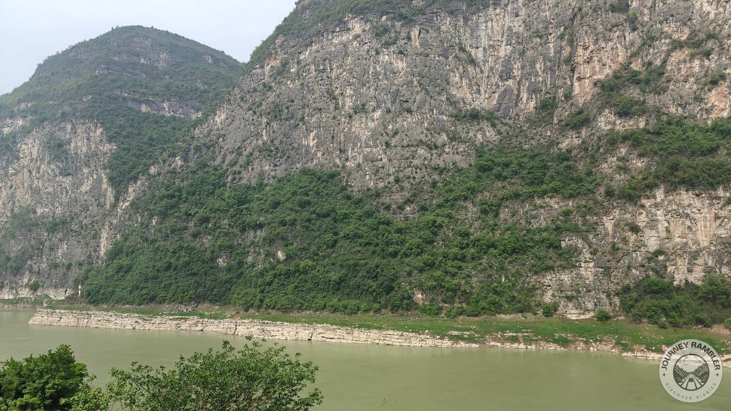 portion of the river with a karst cliff in the background
