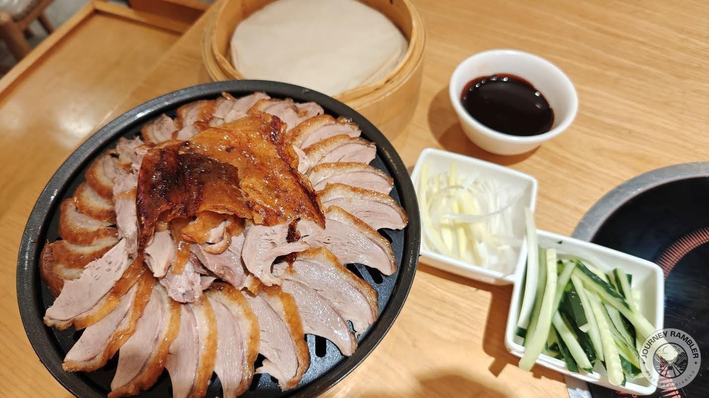 roasted duck some sliced raw vegetables, chun bing and the restaurant’s special roasted duck sauce