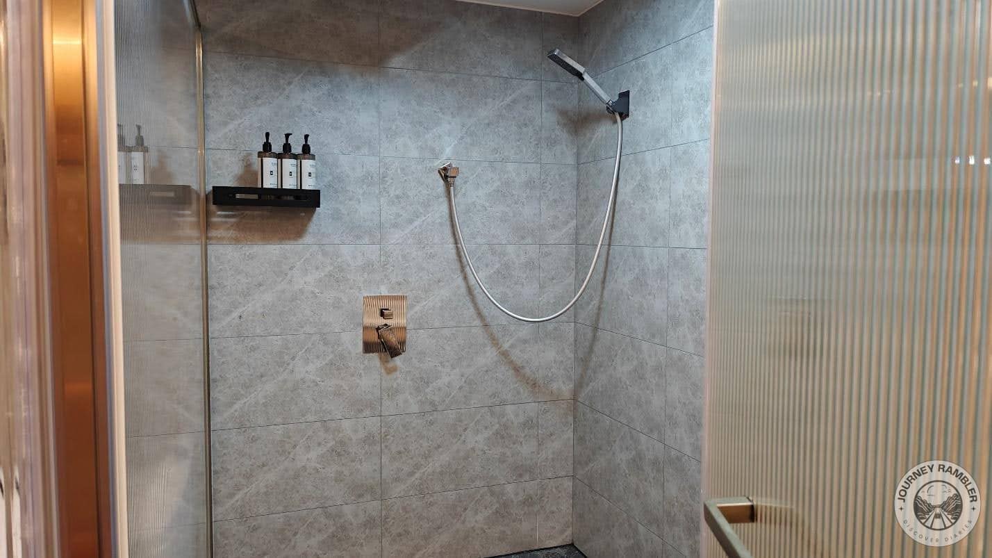 shower head, soap and shampoo caddy
