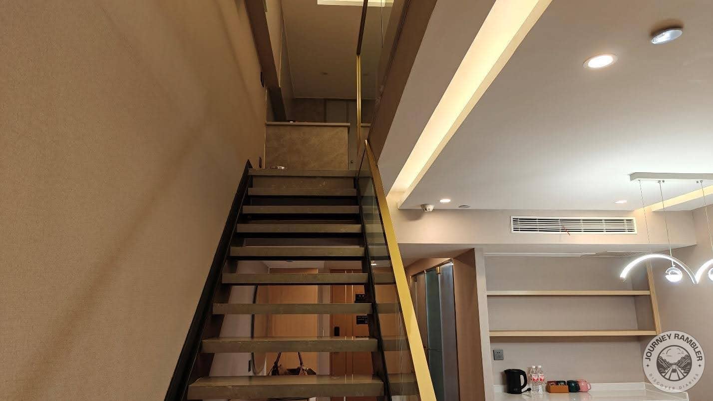 stairs leading up to the second level of the room