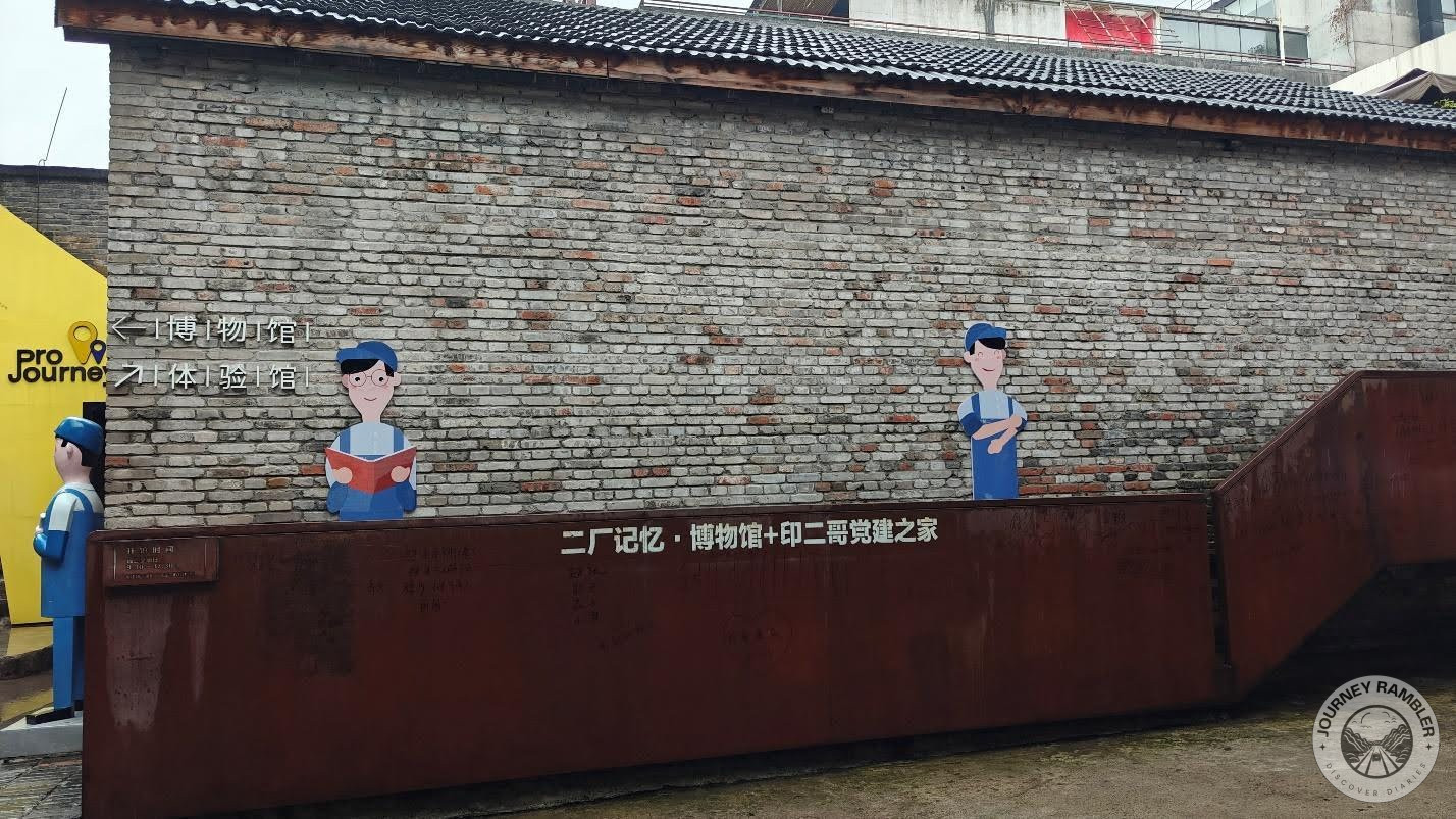 wall with some murals and Chinese characters