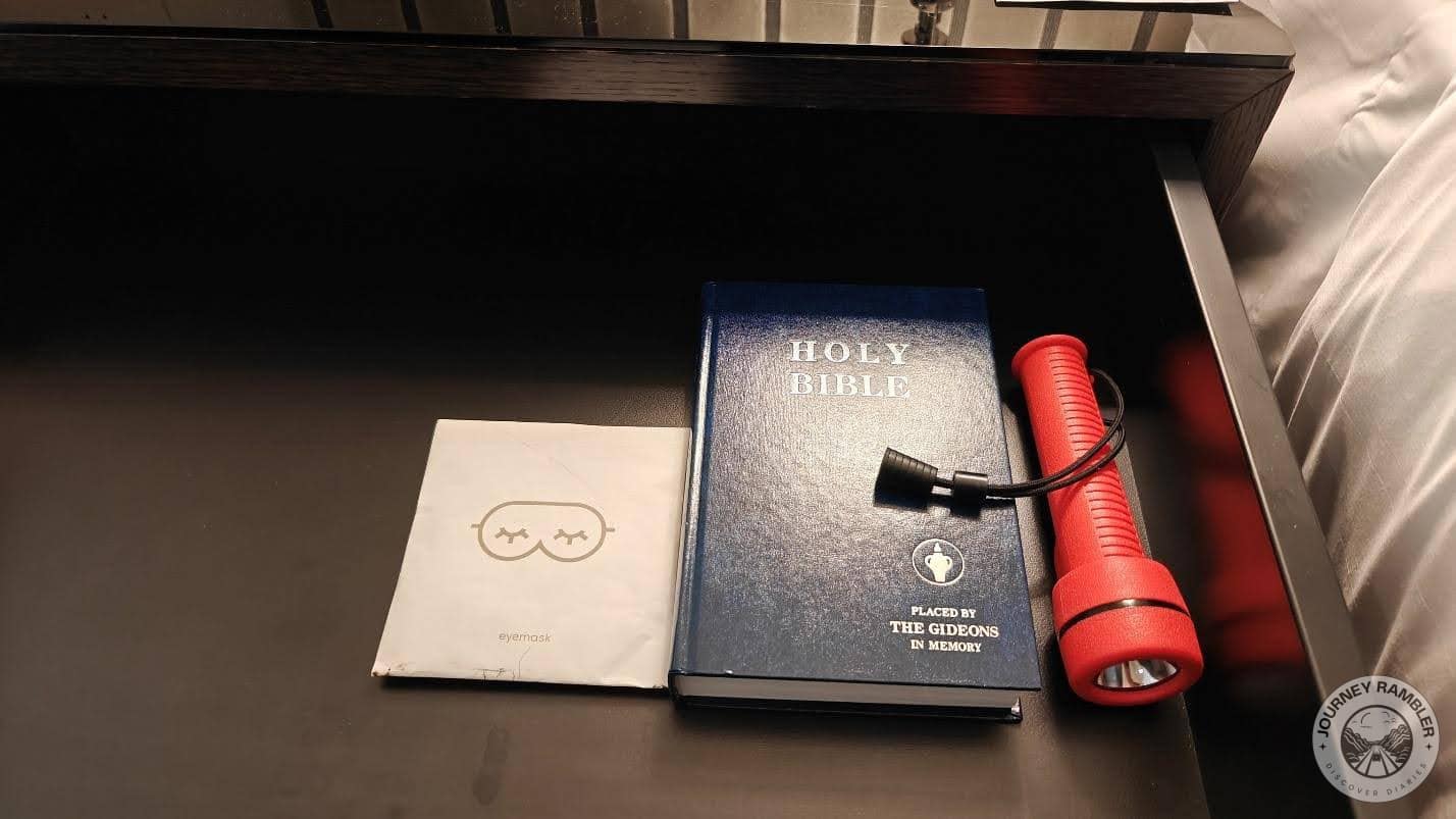 Alongside the Holy Bible sat a torch and an eye mask