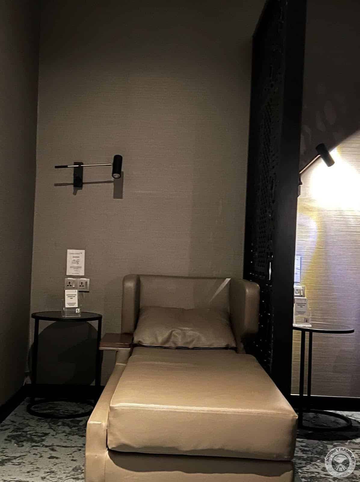Each bed here has a nightstand and a single pillow