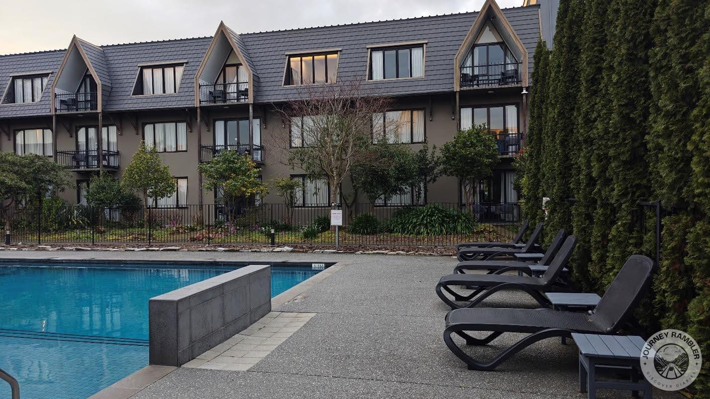 Pool loungers and small wooden tables