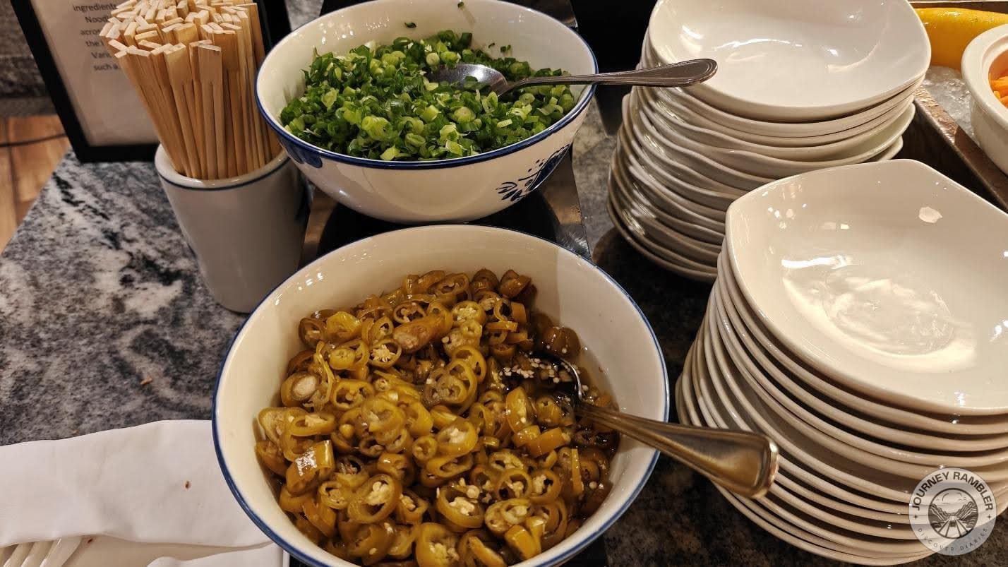 Sliced green onions and pao jiao or pickled peppers