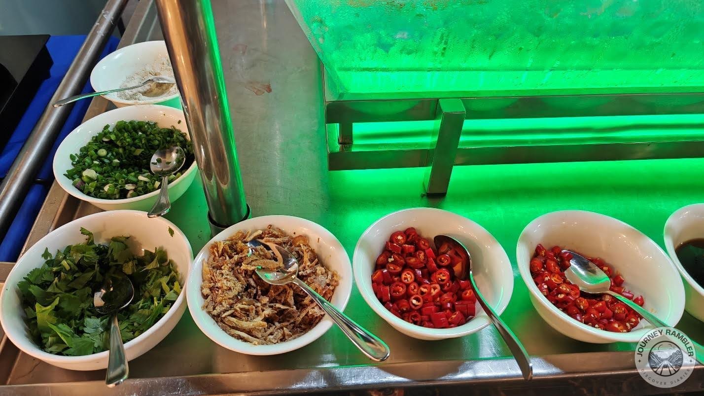 another bowl of chilis here as well as fried onions, cilantro, sliced green onions, and white pepper powder
