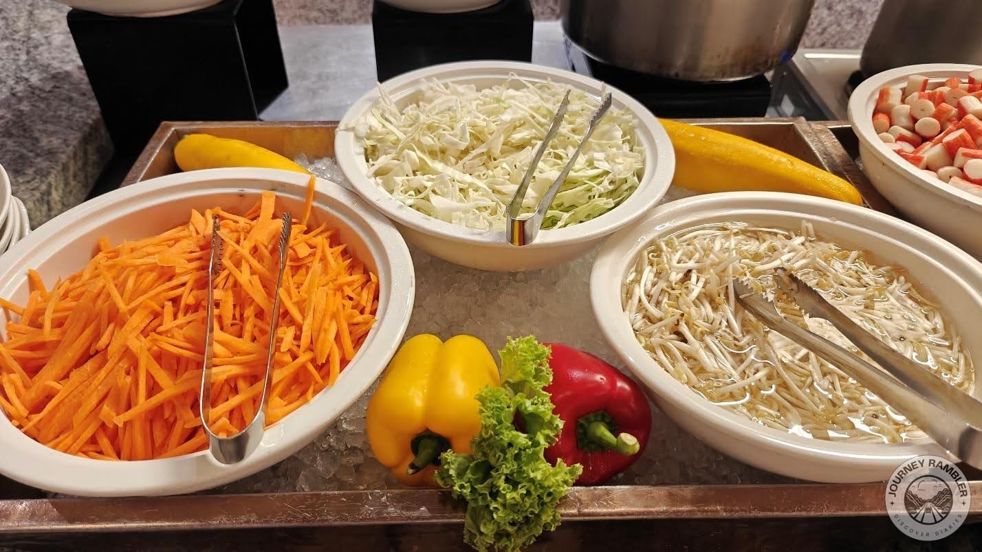 bean sprouts, sliced cabbage, and carrots