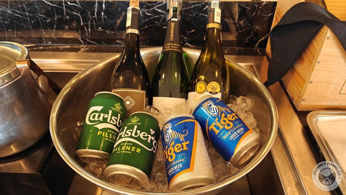 bowl containing cans of Carlsberg and Tiger