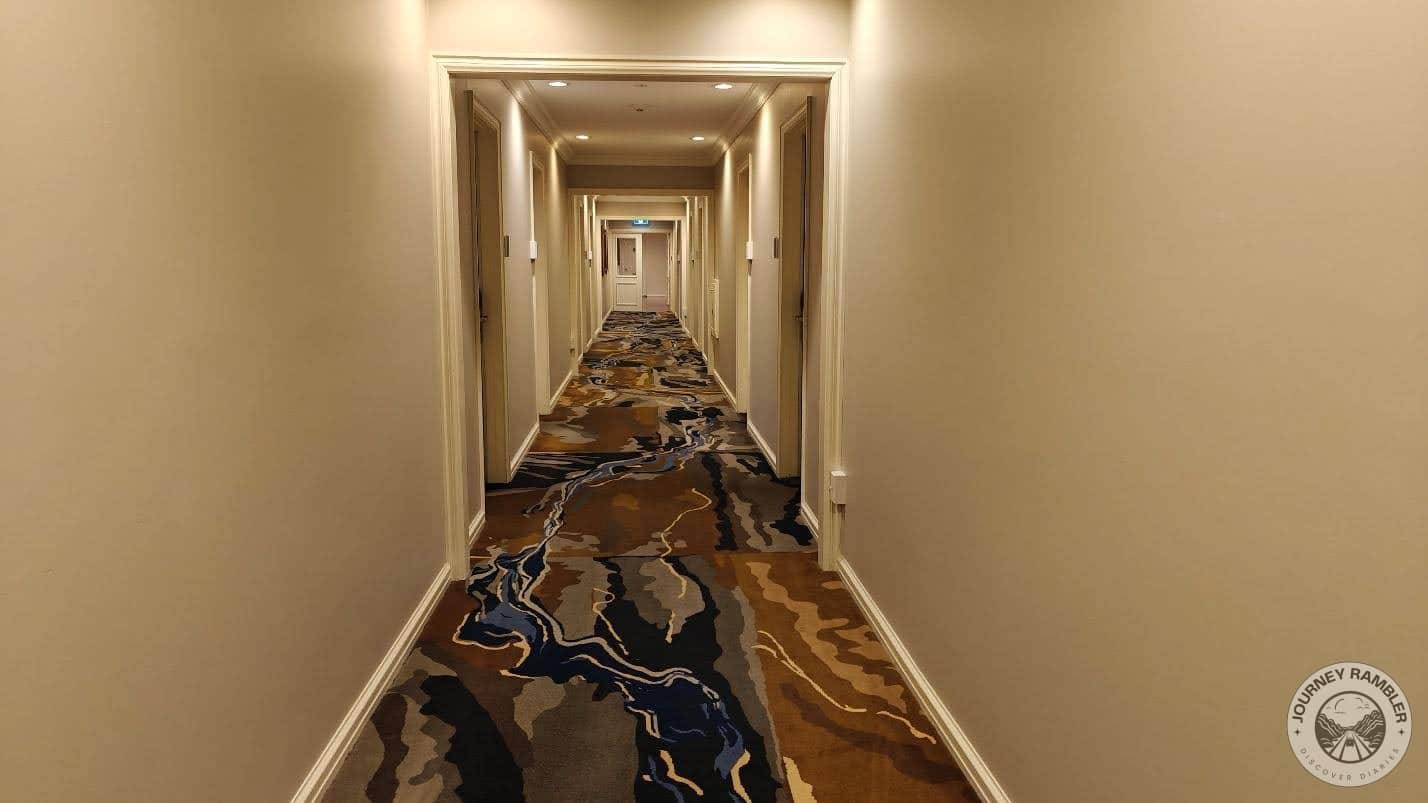 colorful carpet ran down the length of the corridor