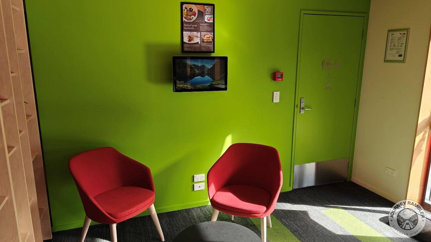 comfortable chairs sat under a small television