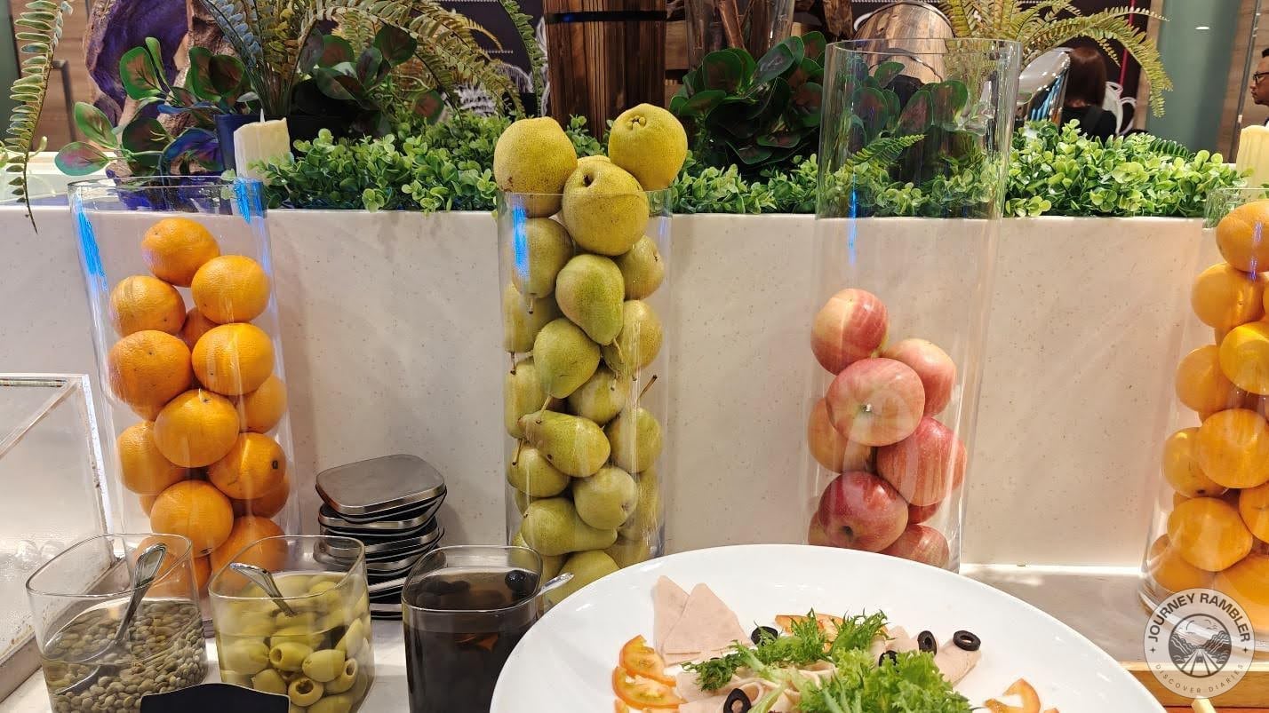glass containers with whole fruits in them