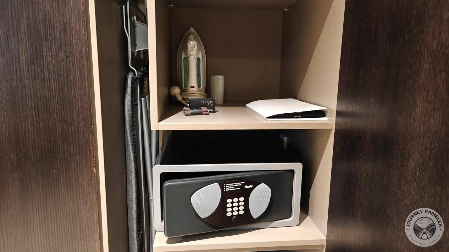 iron, an ironing board and a small personal locker