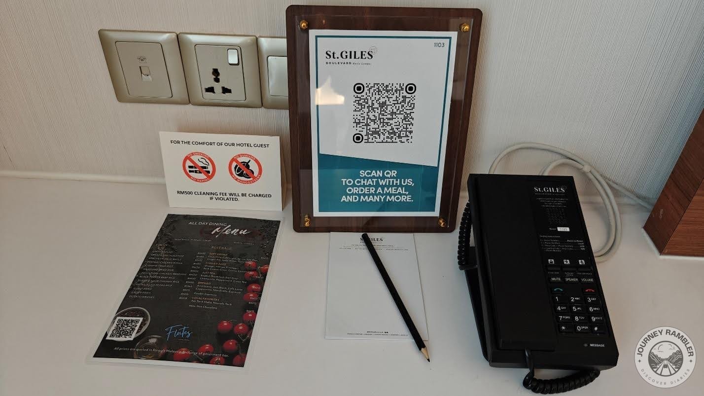 menu for room service and the room's telephone