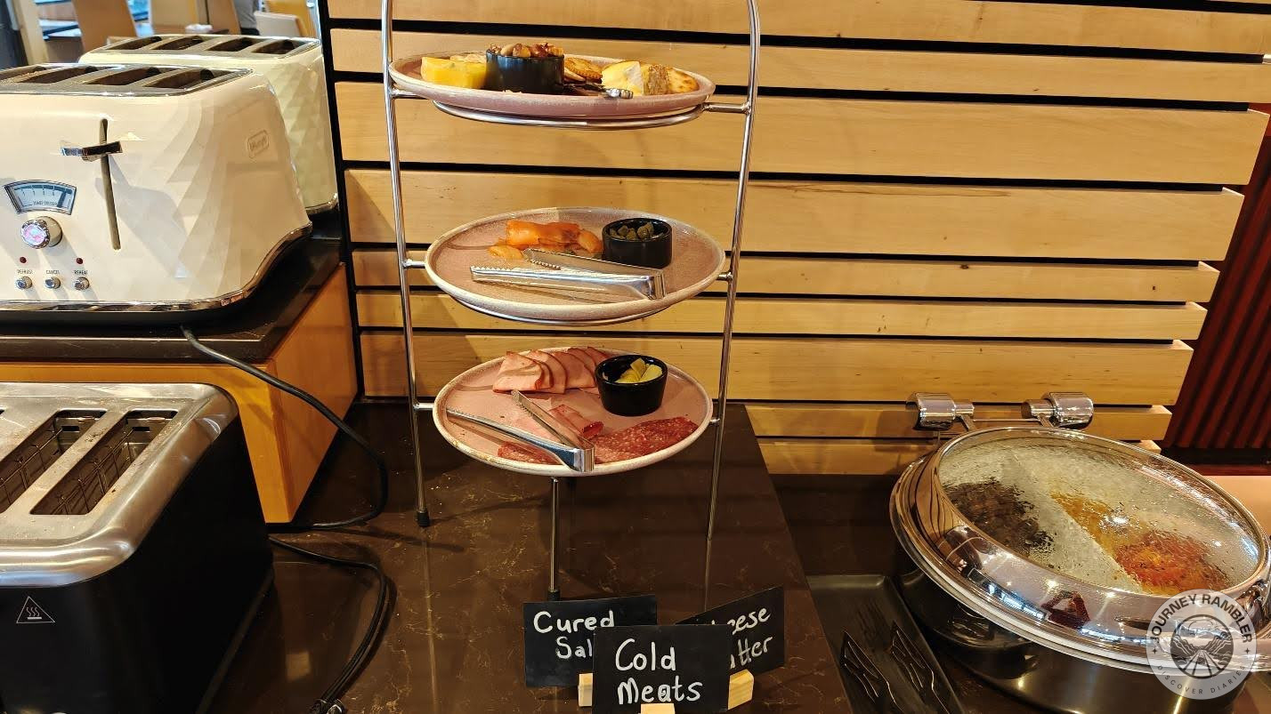 plates filled with cheese, cured salami and cold meats