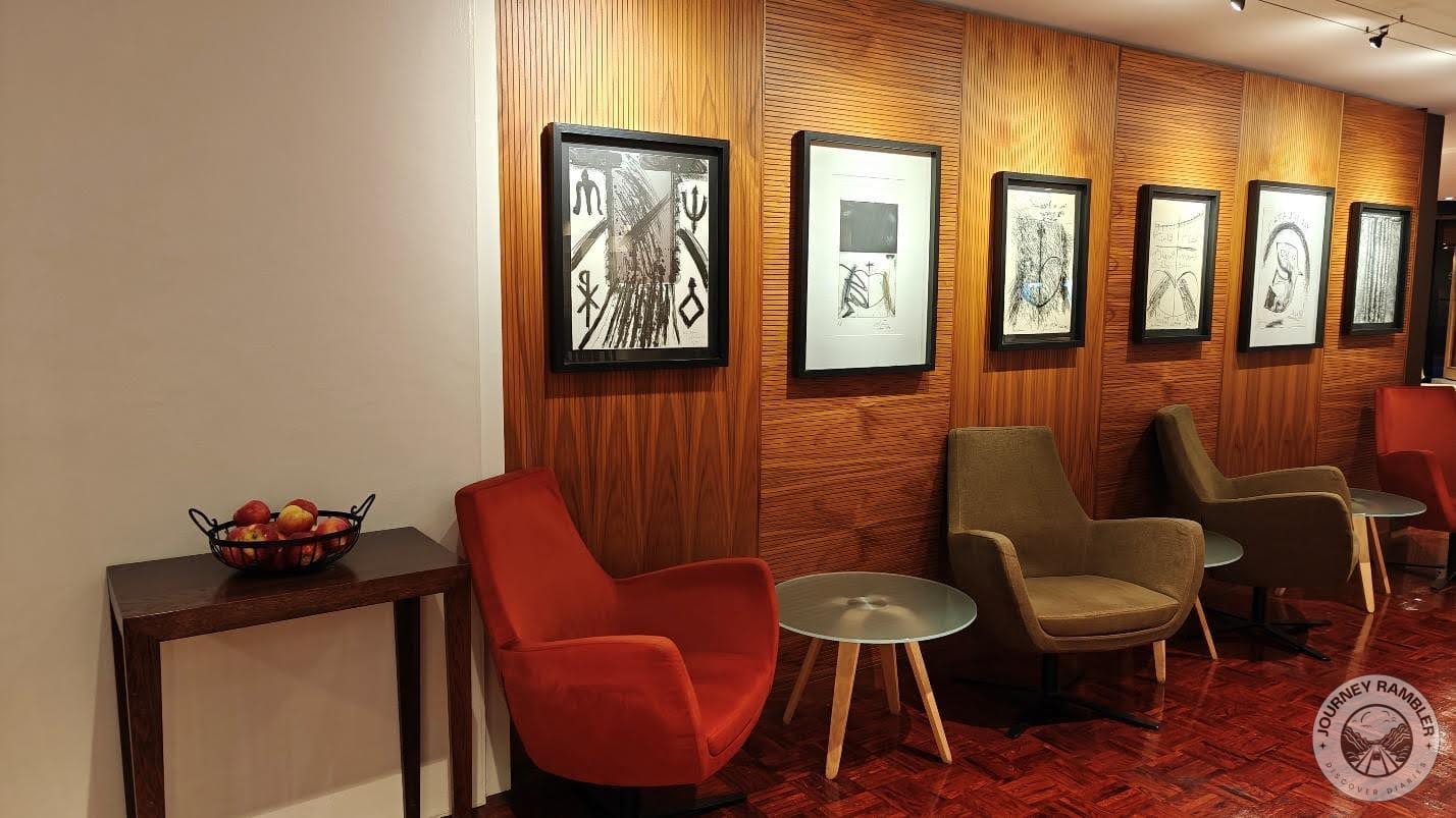 seating area with a lot of interesting and abstract artwork