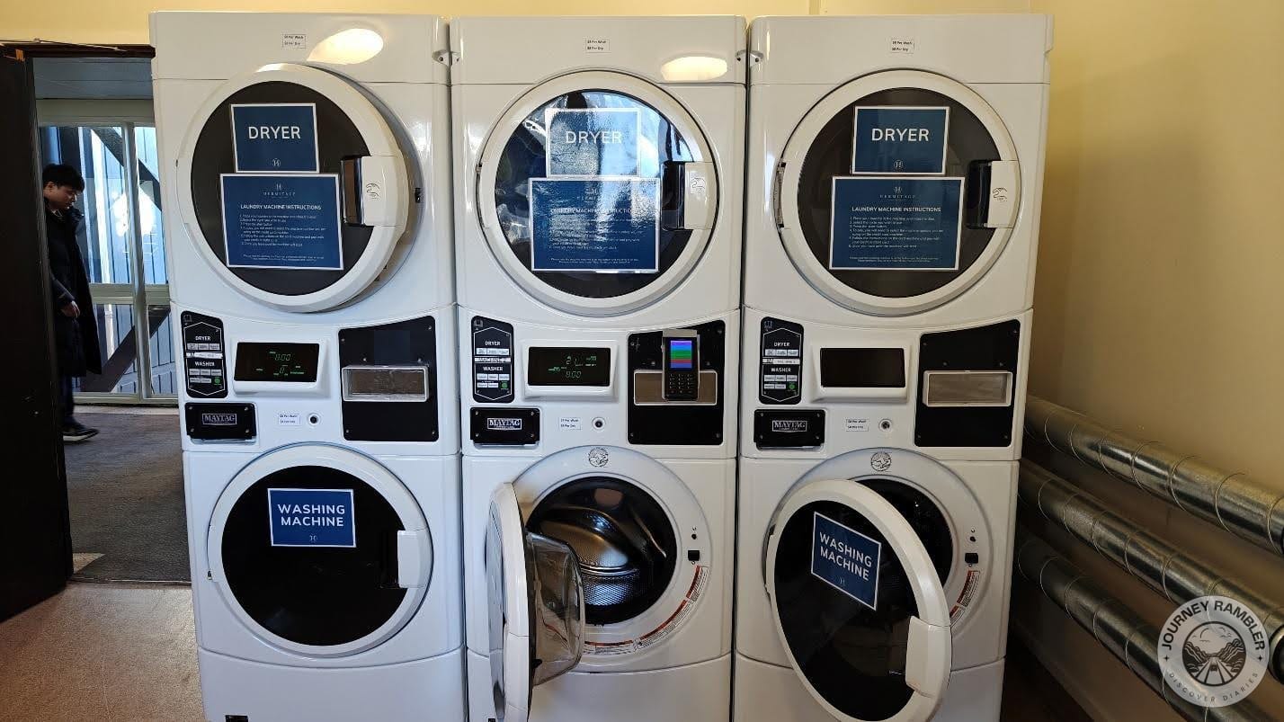 three washing machines and three dryers
