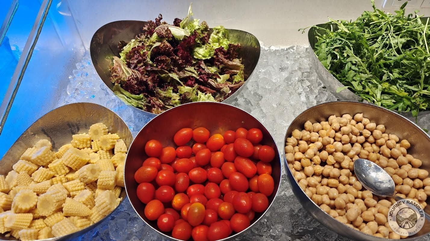 young corn, cherry tomatoes, chickpeas, and lettuce