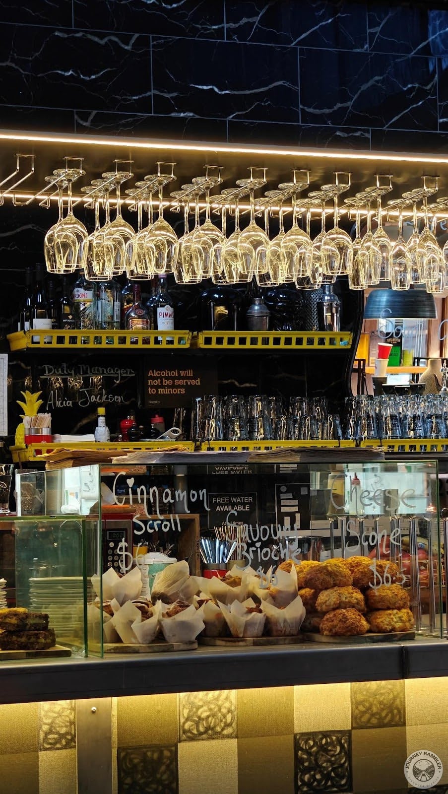 Clean glasses hung above the counter