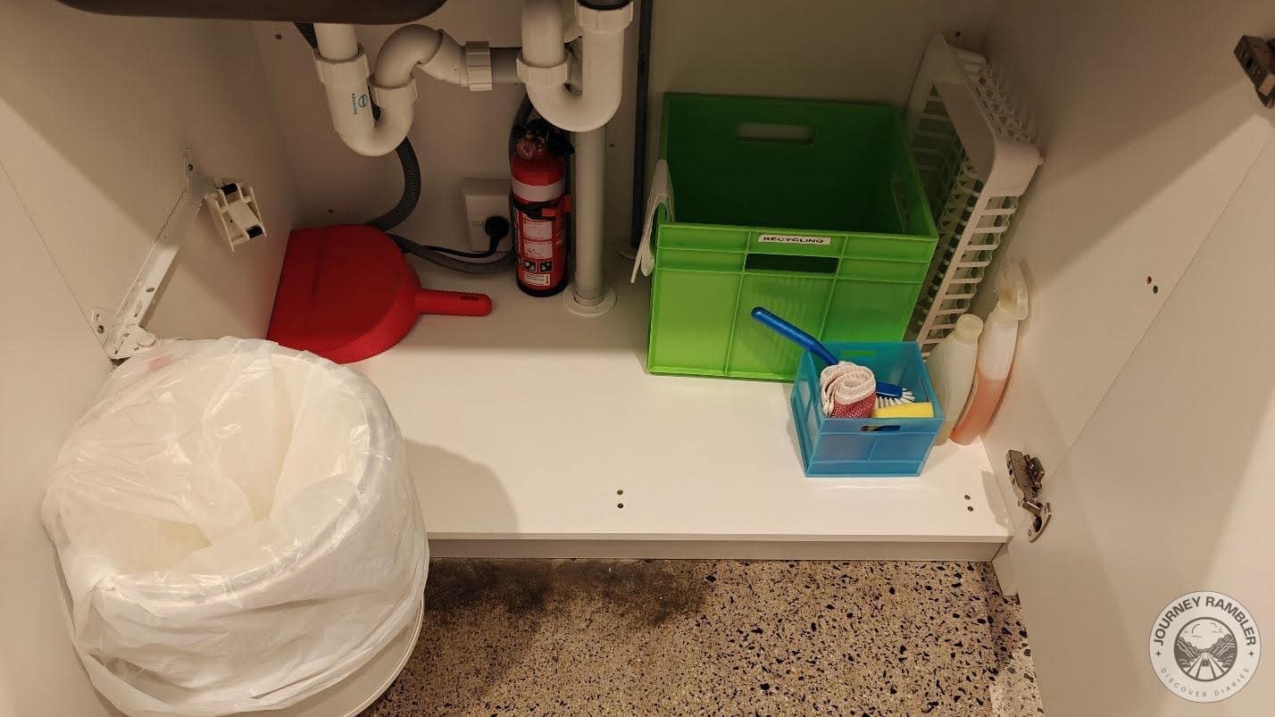 Cleaning supplies and a waste paper basket