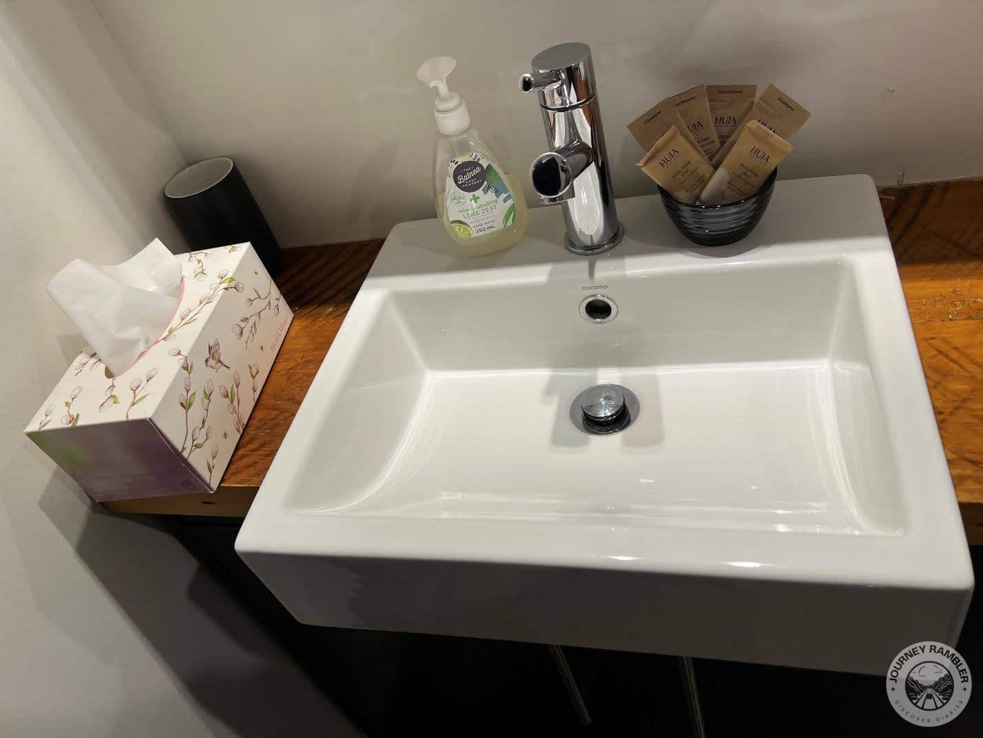 Handwash, sachets of body soap and a box of tissues