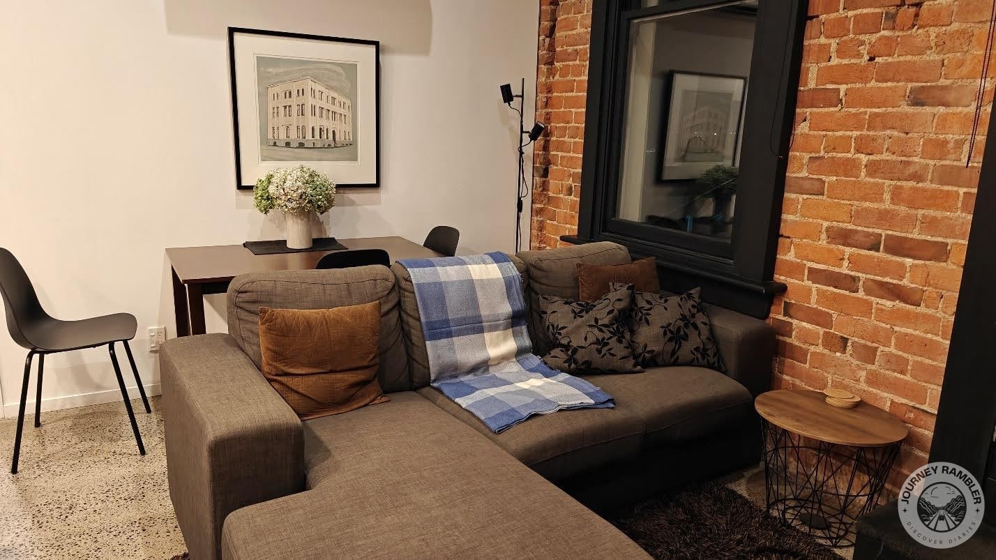 L-shaped couch and a dining table