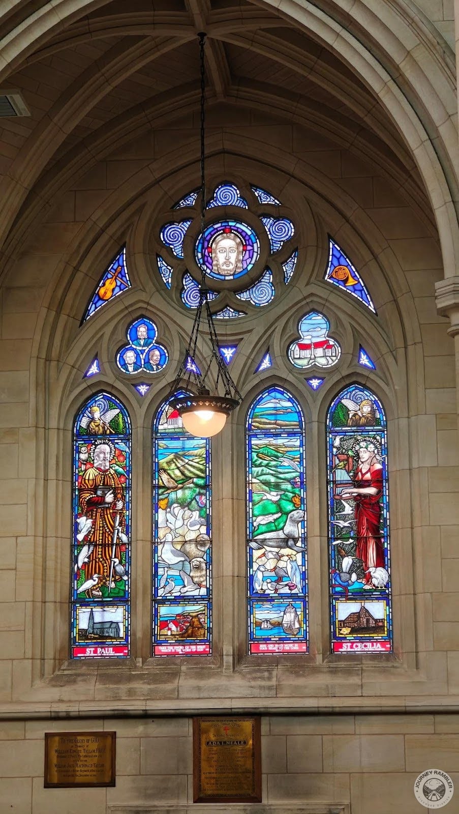 Lamps were hanging in front of all the stained glass windows