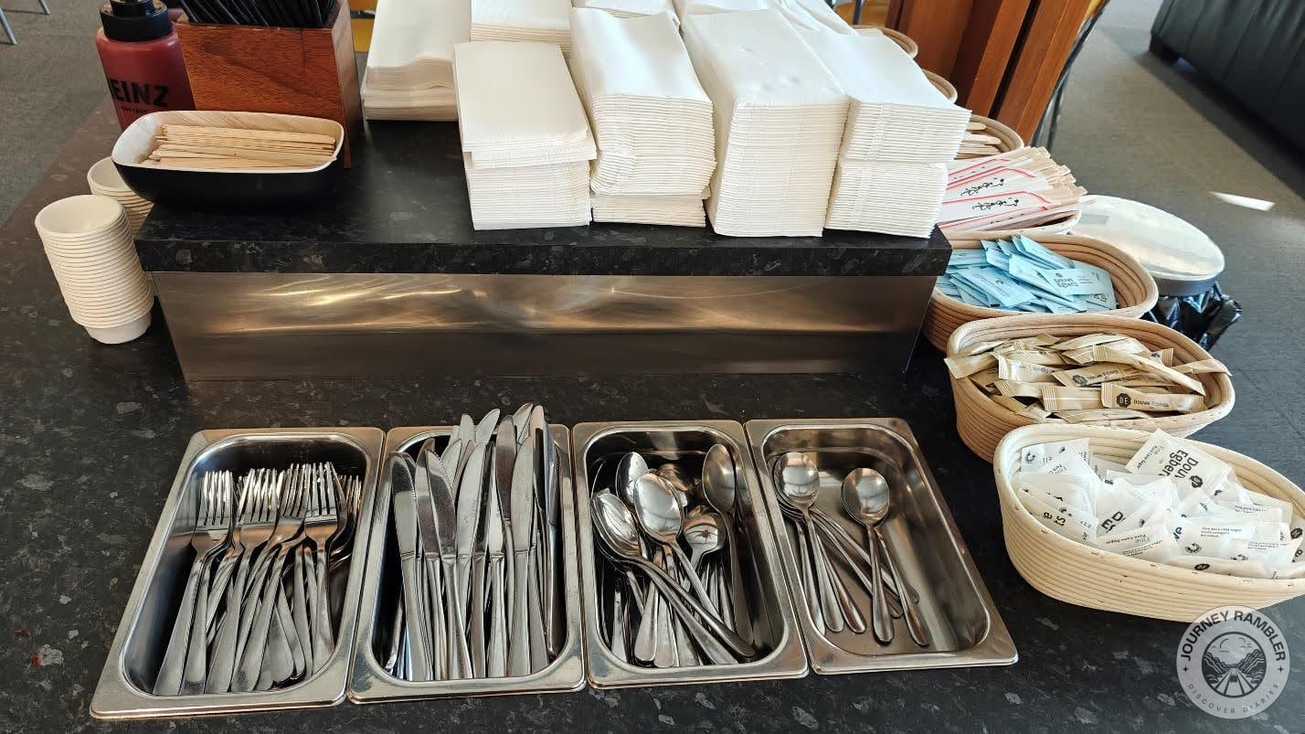 Paper napkins, cutlery and sugar sachets