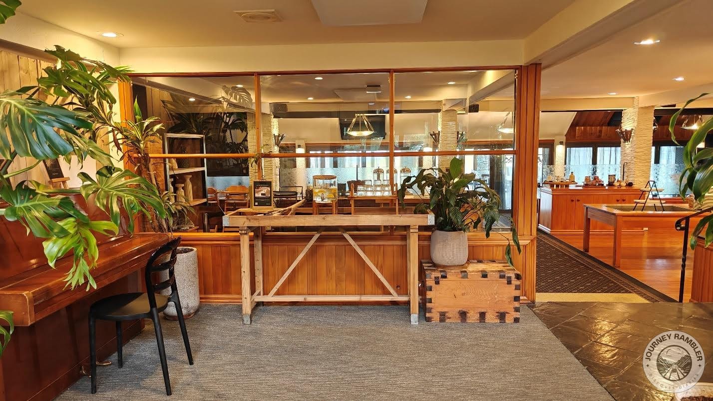 Wooden tables and chests around the lobby area