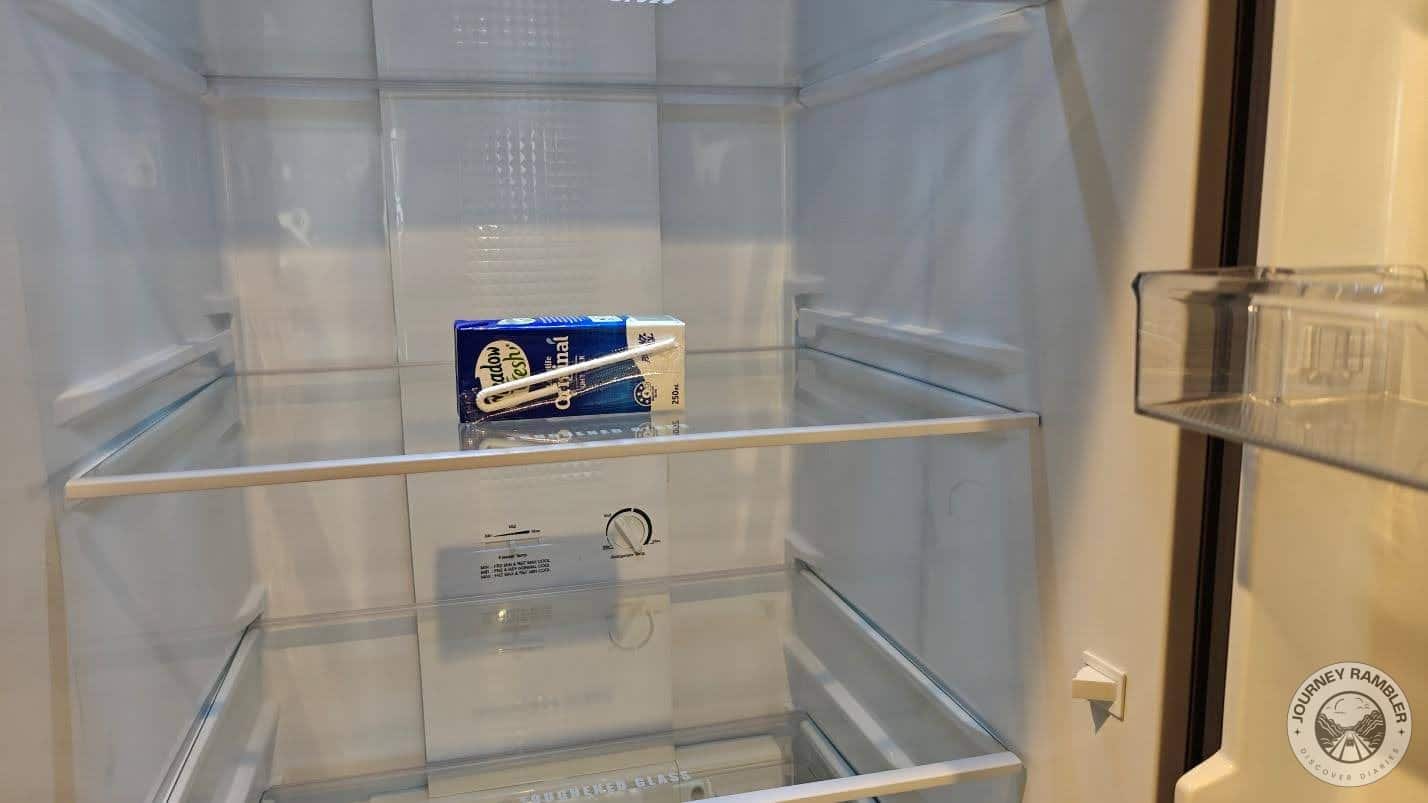 a carton of milk inside the fridge