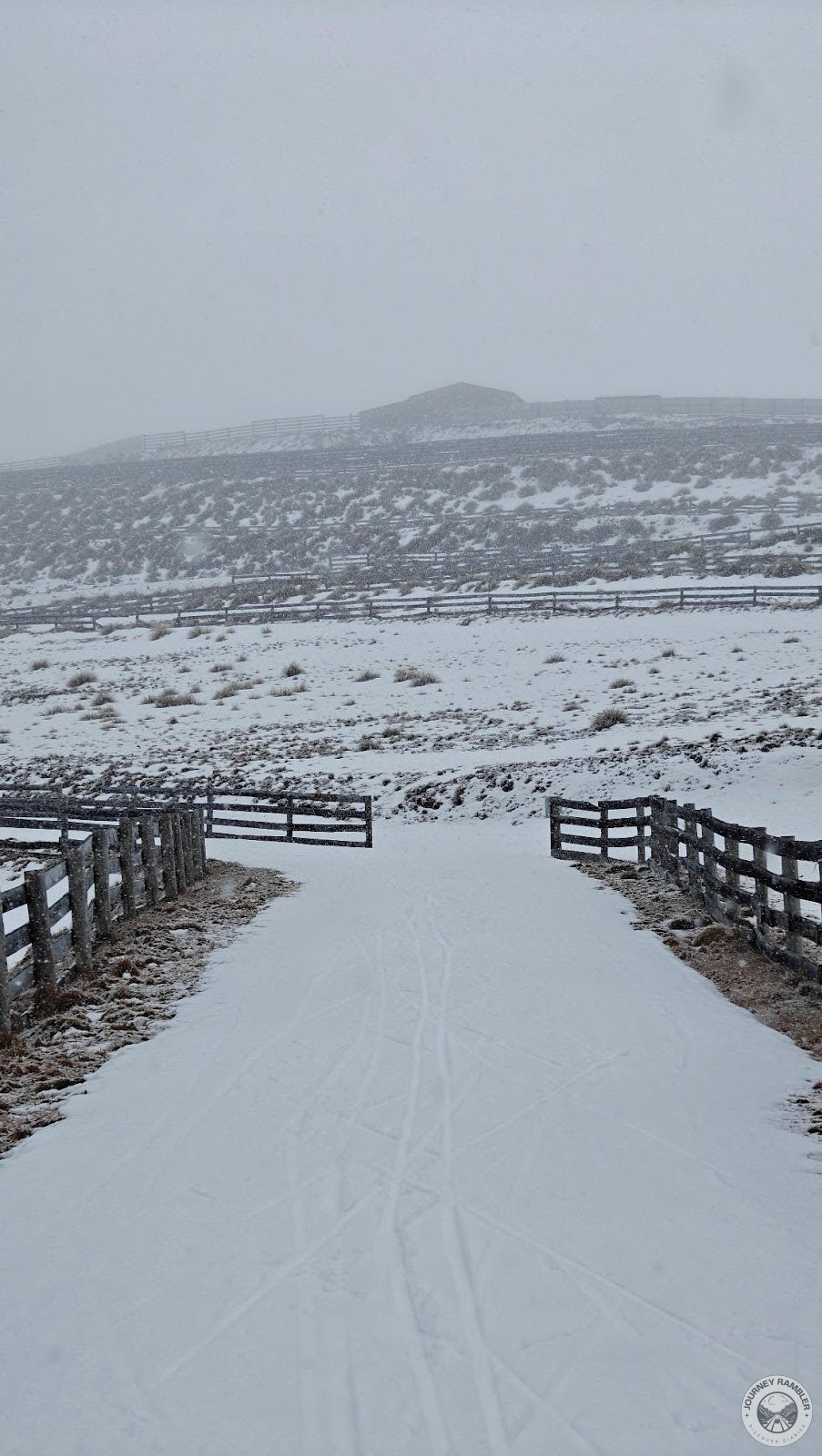 a pair of fences led the way to the nearby buildings