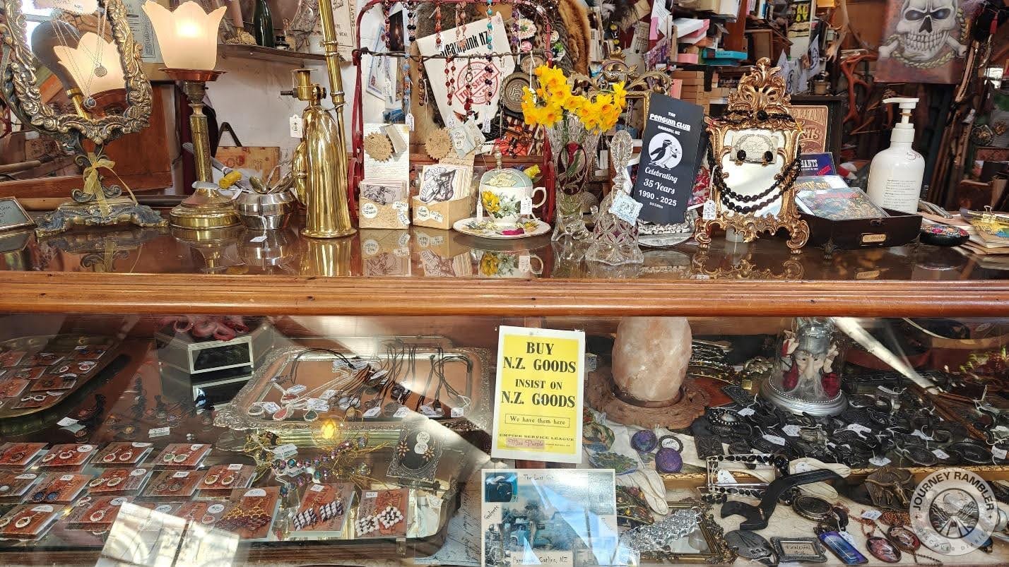 another glass cabinet with all kinds of jewelry inside
