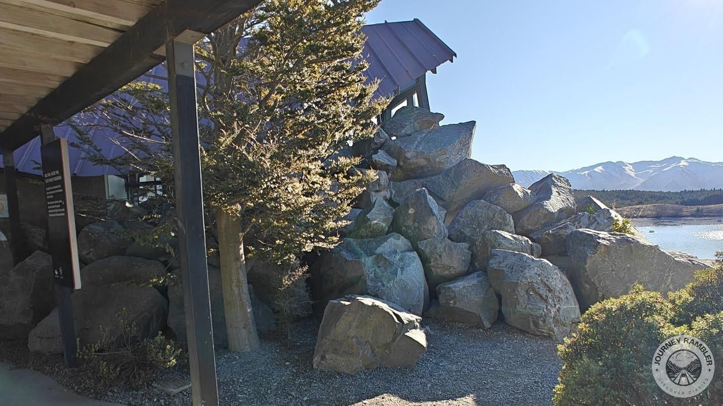big rocks and boulders right next to the lake