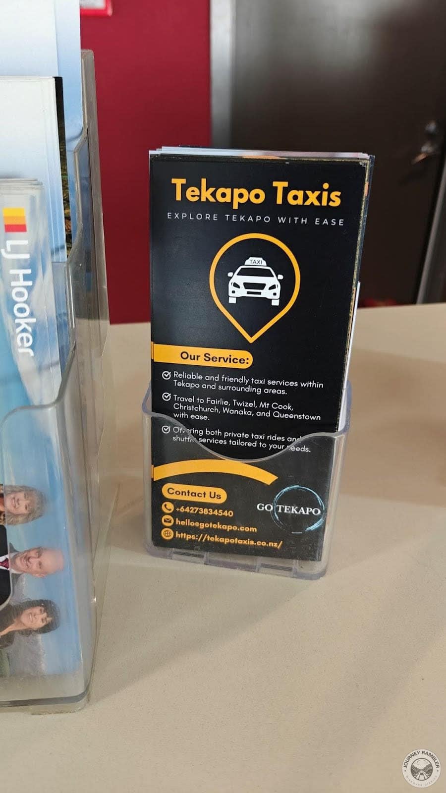 brochures and pamphlets about renting taxis on the front desk