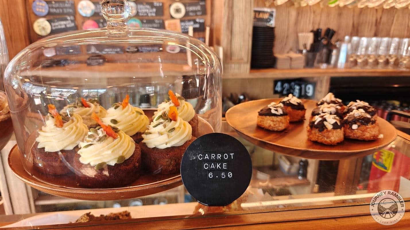 carrot cake had a swirl of cream on top