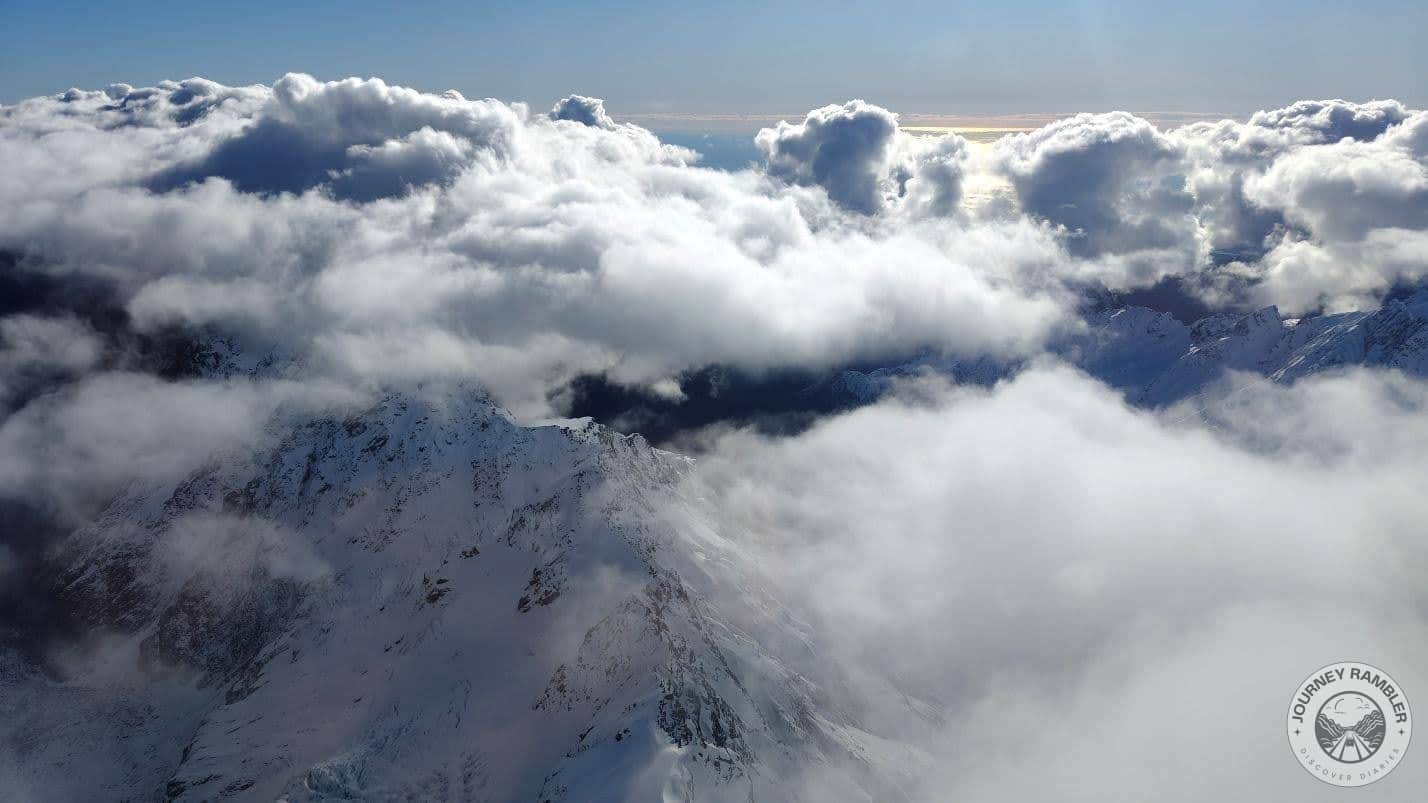 clouds in the mountains surrounding the glacier