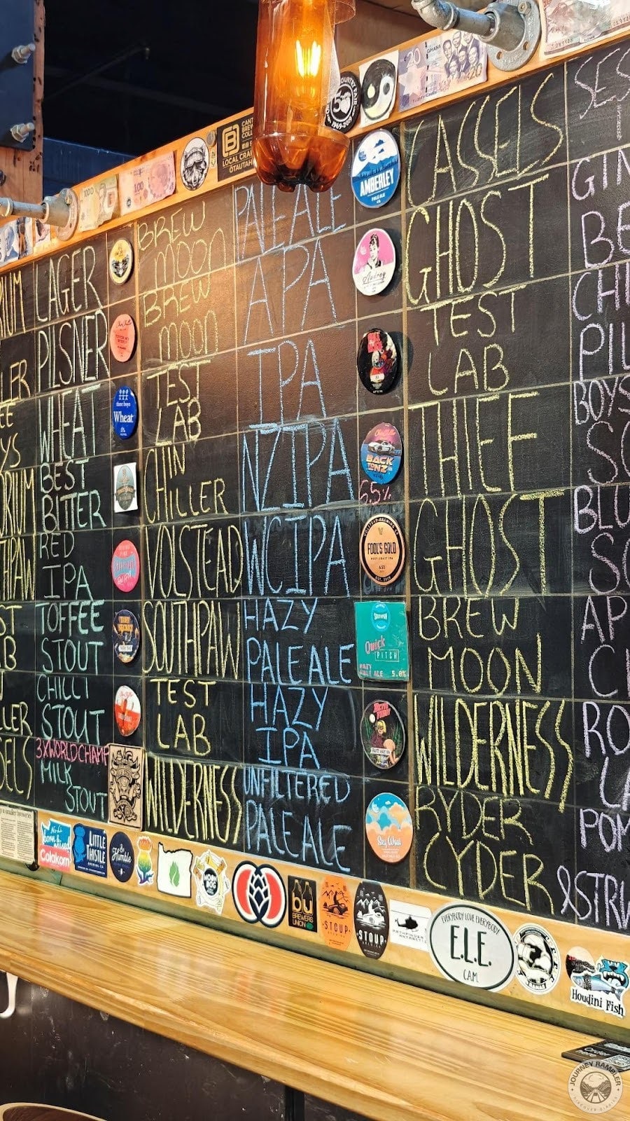 corner of the bar that shows the available beers they have