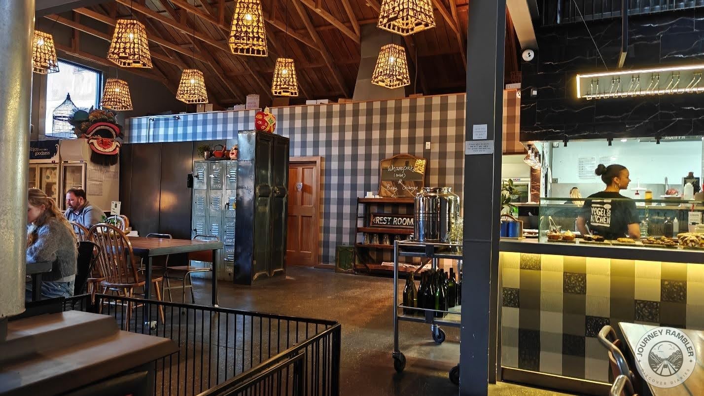 customers sitting at the wooden tables