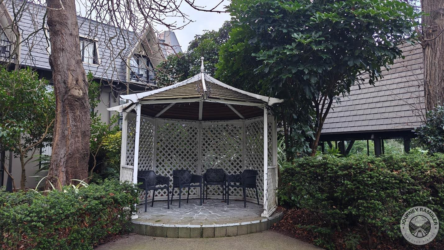 cute little gazebo with four chairs inside