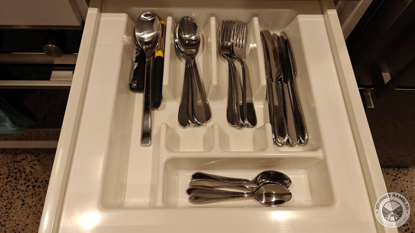 cutlery drawer, filled with knives, forks and spoons